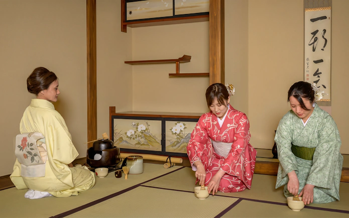 Women in kimonos performing a tea ceremony in Shinjuku, Japan.