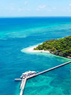 Green Island cruise boat on clear waters near Cairns, Australia.