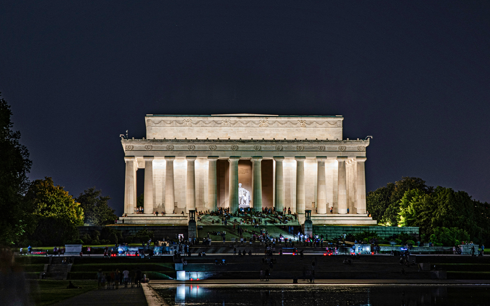 Lincoln Memorial illuminated at night with visitors, Washington D.C.