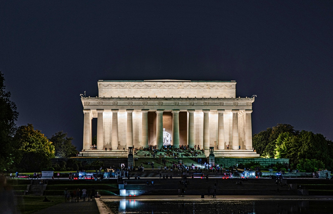 Lincoln Memorial illuminated at night with visitors, Washington D.C.