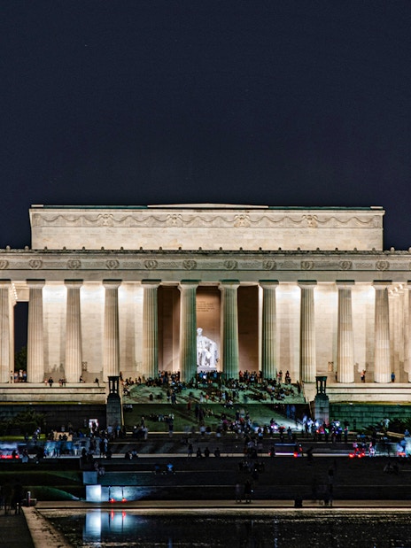 Lincoln Memorial illuminated at night with visitors, Washington D.C.