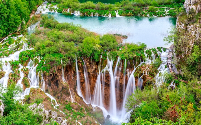 Waterfalls and lush greenery at Plitvice Lakes National Park, Croatia, on a tour from Split.