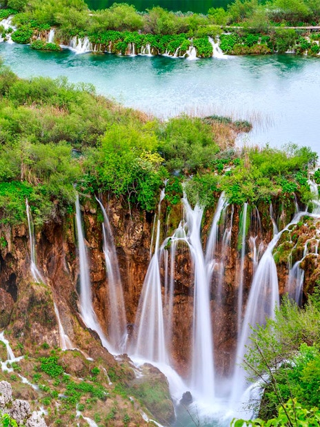 Waterfalls and lush greenery at Plitvice Lakes National Park, Croatia, on a tour from Split.