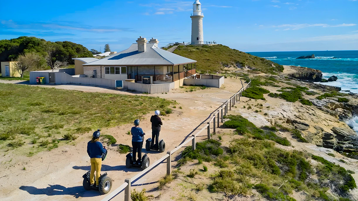 Tourist riding a Segway along a scenic path on Rottnest Island, Australia.