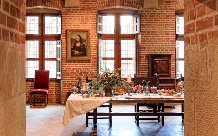Festive table setting at Clos Lucé Castle with Christmas decorations.