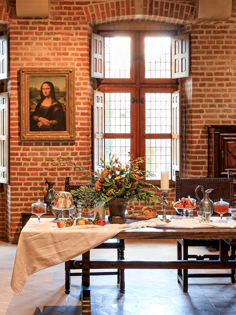 Festive table setting at Clos Lucé Castle with Christmas decorations.