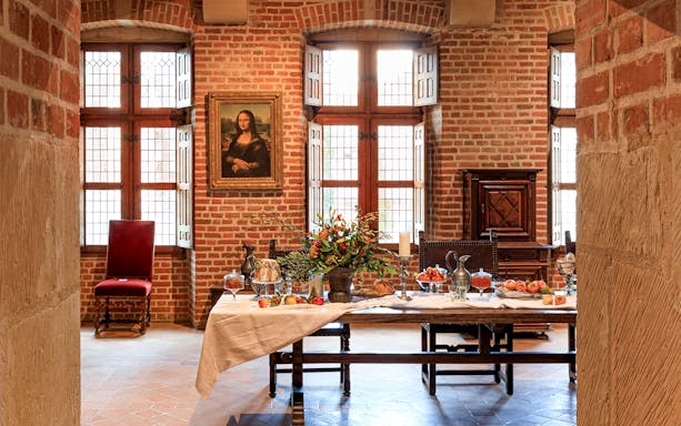 Festive table setting at Clos Lucé Castle with Christmas decorations.