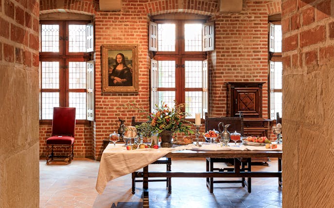 Festive table setting at Clos Lucé Castle with Christmas decorations.