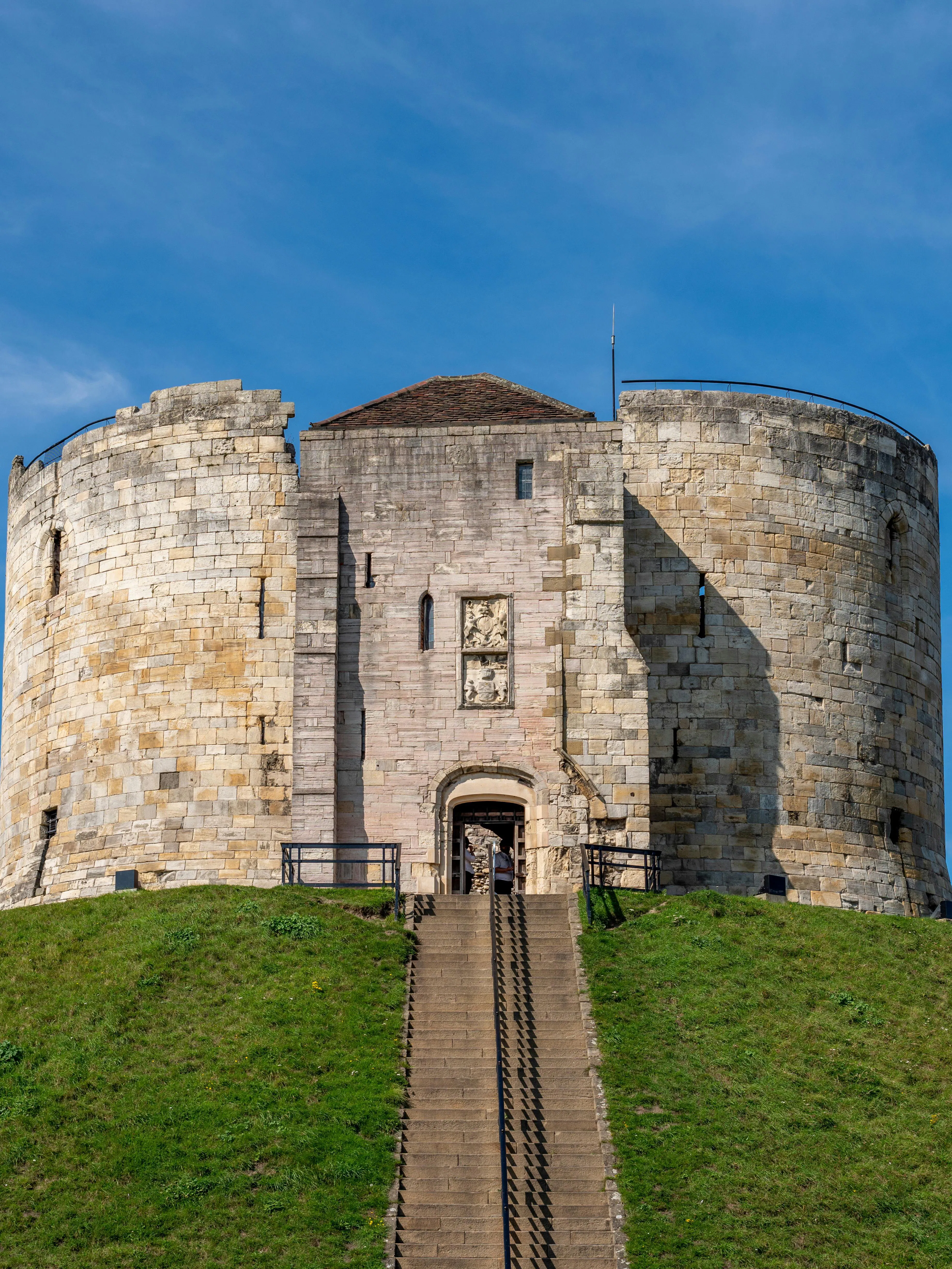 Cliffords Tower Norman Castle in York with stone walls and entrance staircase.