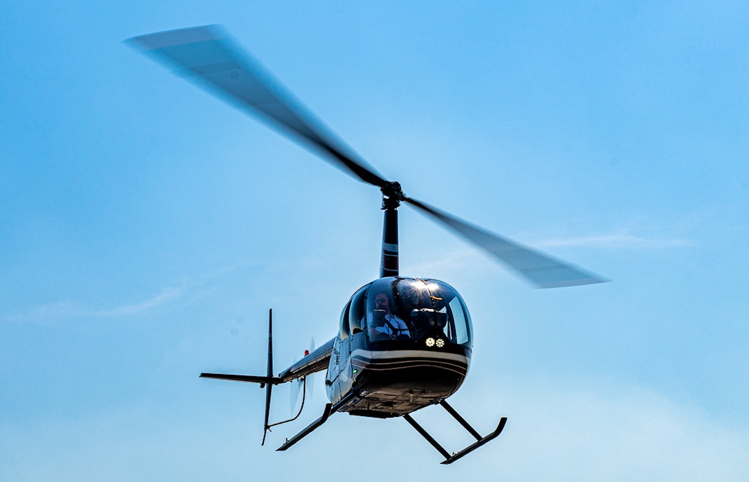 Helicopter in flight for shared NYC tour from Westchester.
