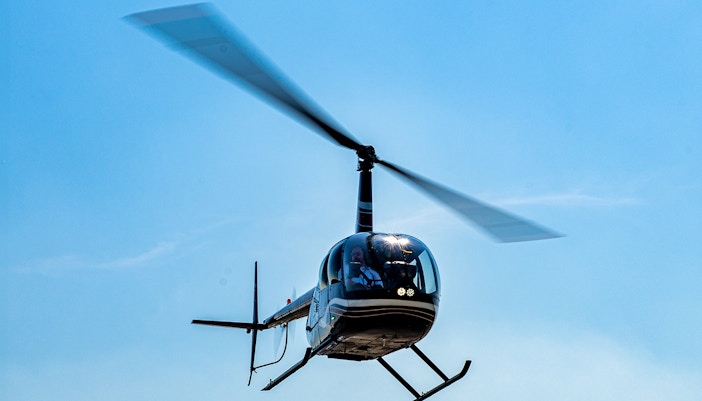 Helicopter in flight for shared NYC tour from Westchester.