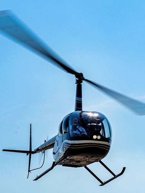 Helicopter in flight for shared NYC tour from Westchester.