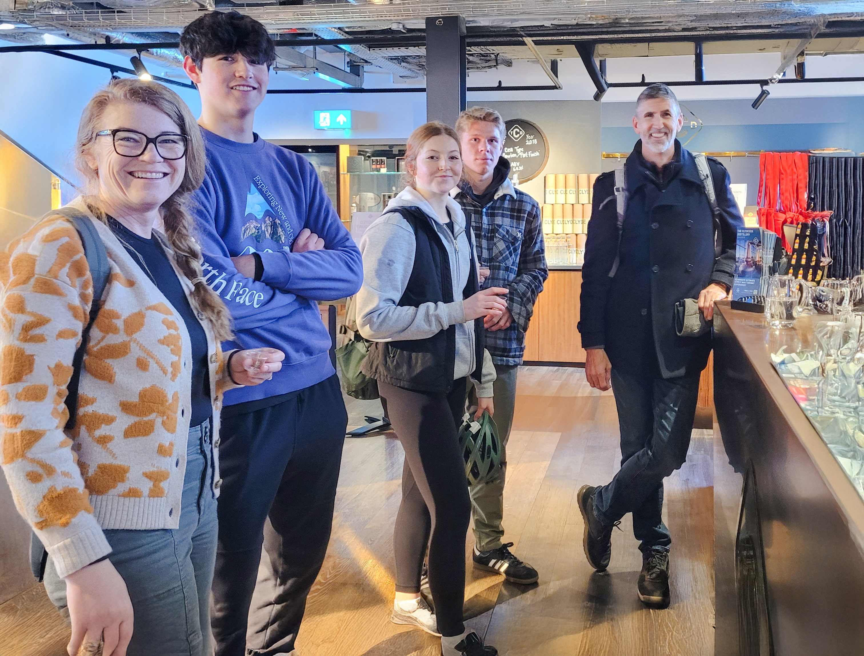 Guests enjoying whiskey tasting experience in Glasgow distillery.
