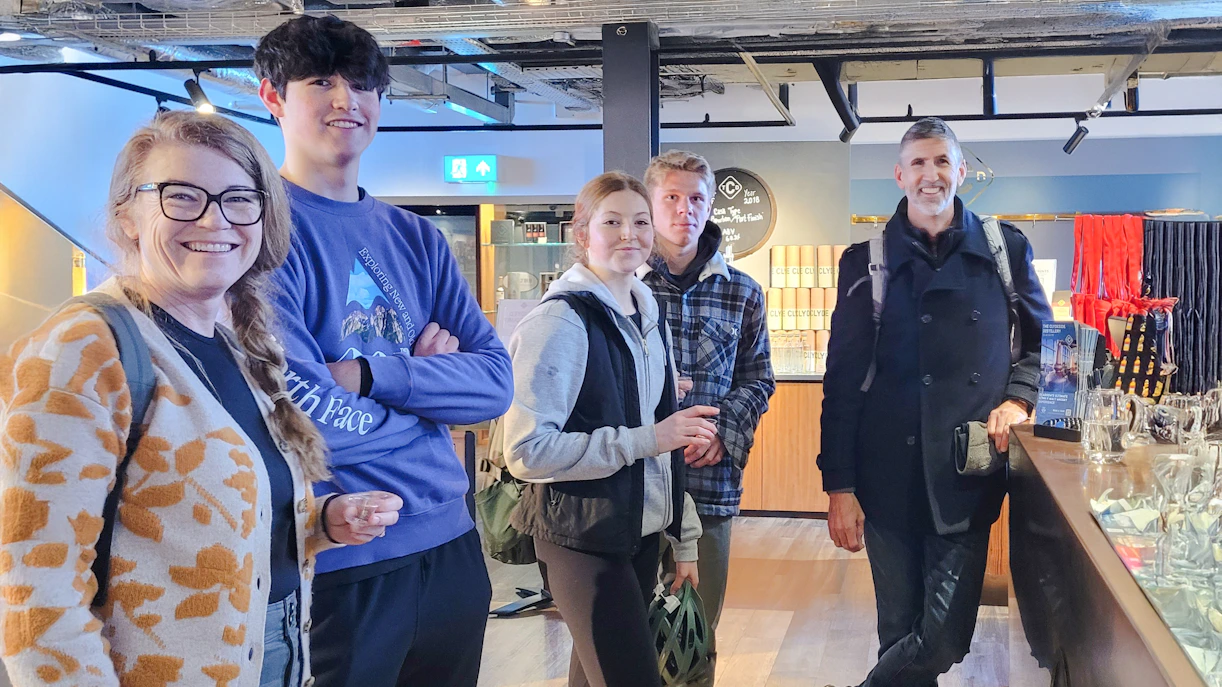 Guests enjoying whiskey tasting experience in Glasgow distillery.