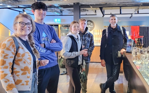 Guests enjoying whiskey tasting experience in Glasgow distillery.