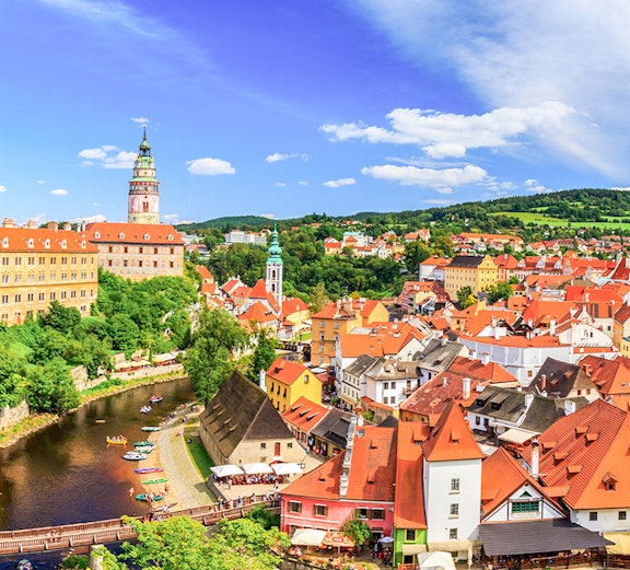Český Krumlov's historic center with red-roofed buildings and the Vltava River, Czech Republic.