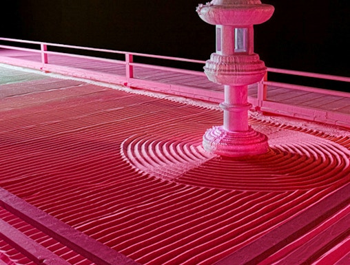 Zen garden with stone lantern at Moco Museum London exhibit.