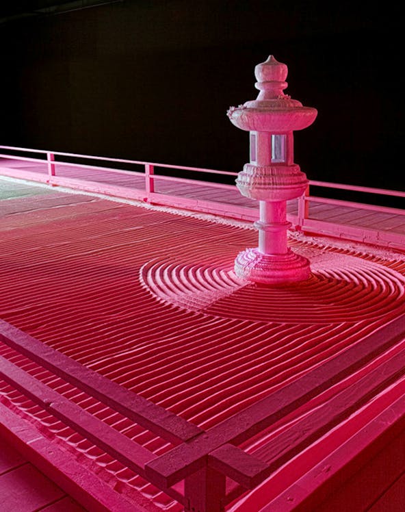 Zen garden with stone lantern at Moco Museum London exhibit.