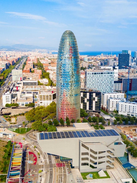 Aerial view of Glories Skyline Tower in Barcelona surrounded by cityscape.