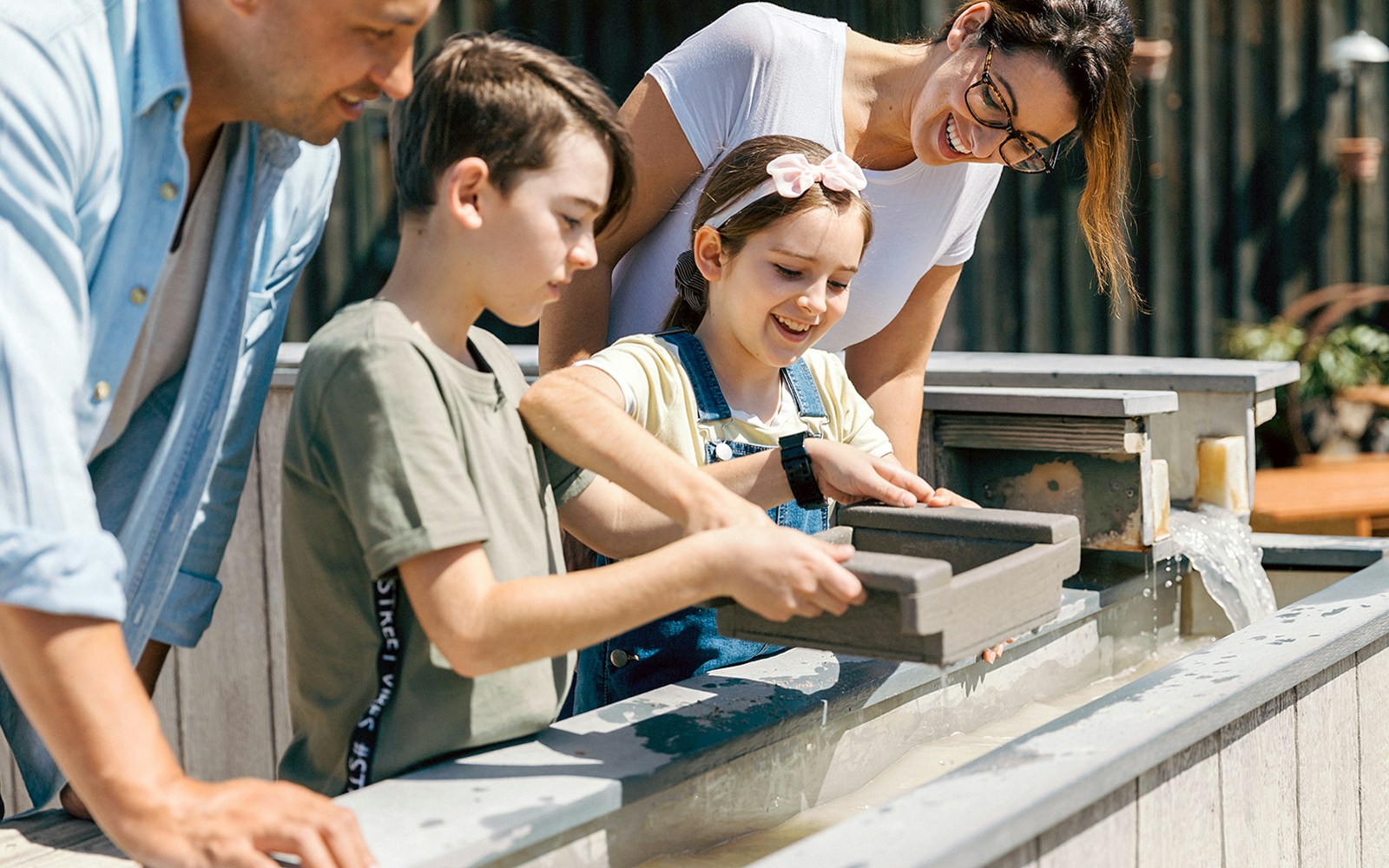 A family Gold panning at Paradise Country