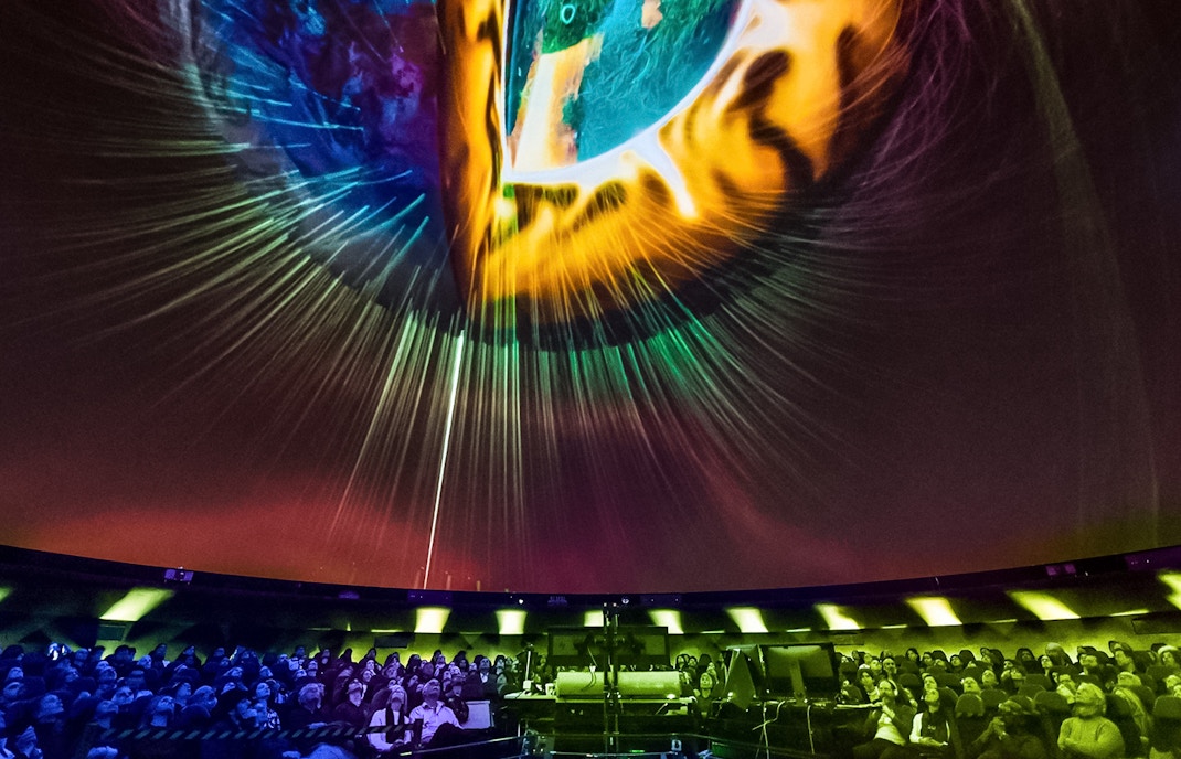 American Museum of Natural History planetarium exhibit, New York, exploring cosmic mysteries.