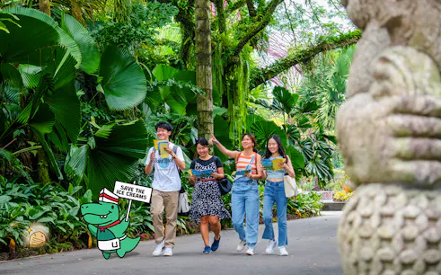 Group exploring lush garden during RANSACK PUZZLE HUNT: The Meltdown Menace.