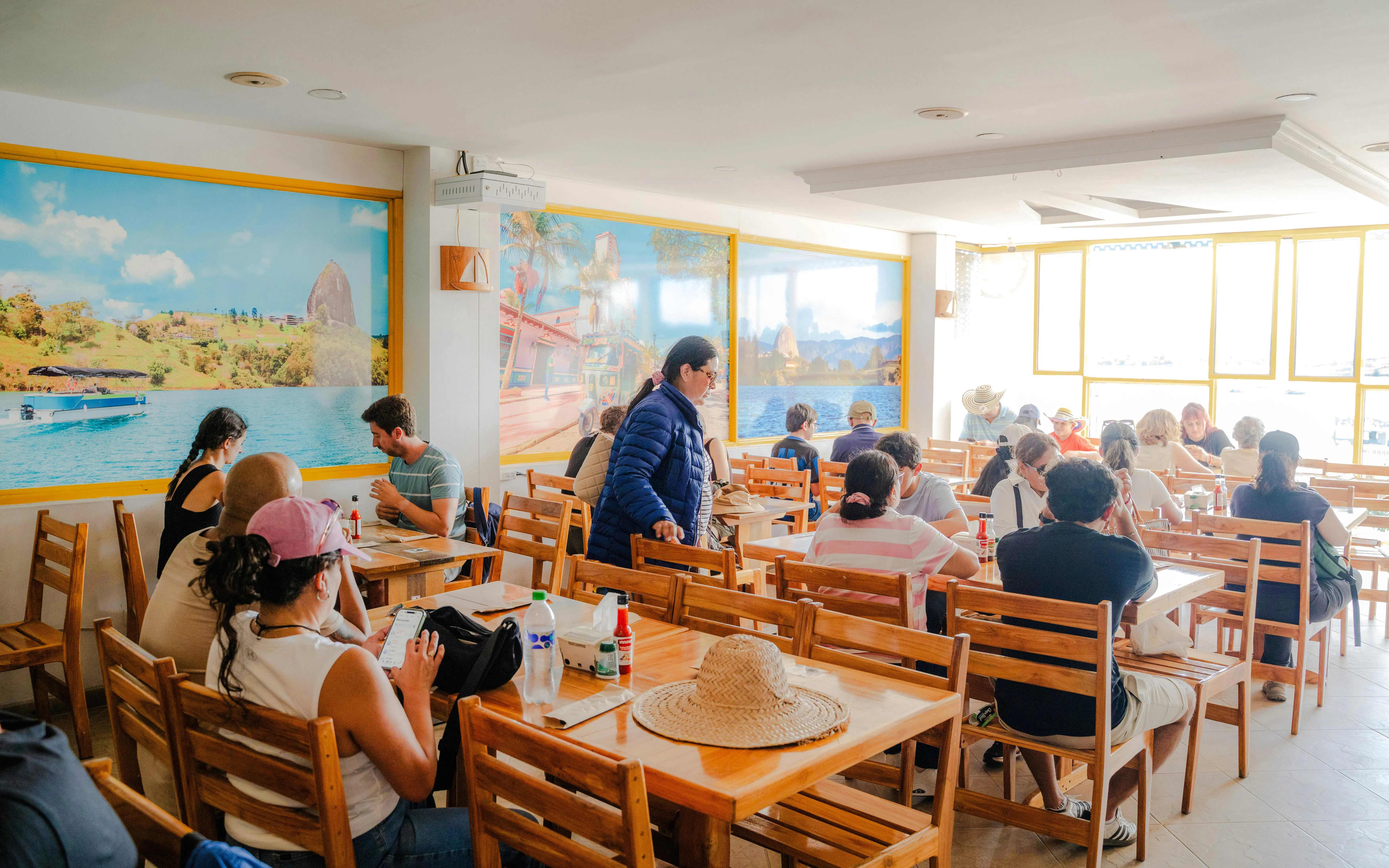 Guests dining at a restaurant during Guatapé & El Peñol Full-Day Tour.