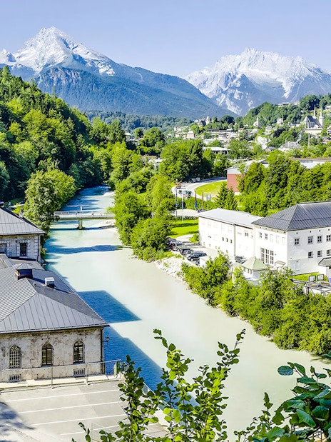 Aerial view of Berchtesgaden Salt Mine in Bavaria with surrounding mountains and river.