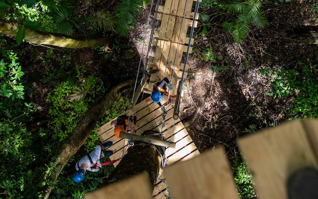 Participants on a zipline platform in Daintree Rainforest, Australia.