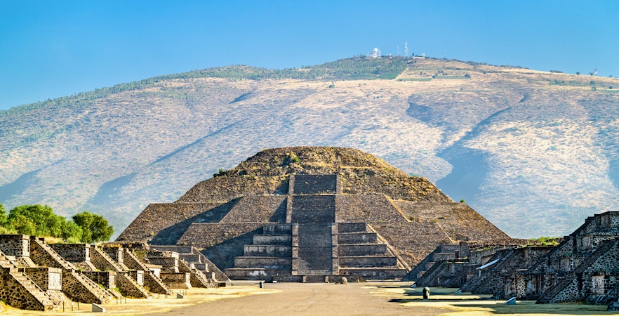 Pyramid of the Moon at Teotihuacan, Mexico, with surrounding ancient structures.