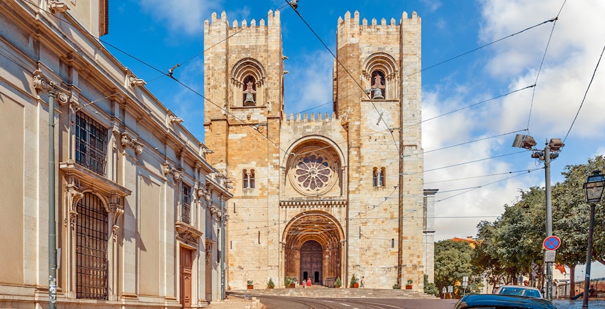 Lisbon Cathedral facade with twin towers and rose window, Portugal.