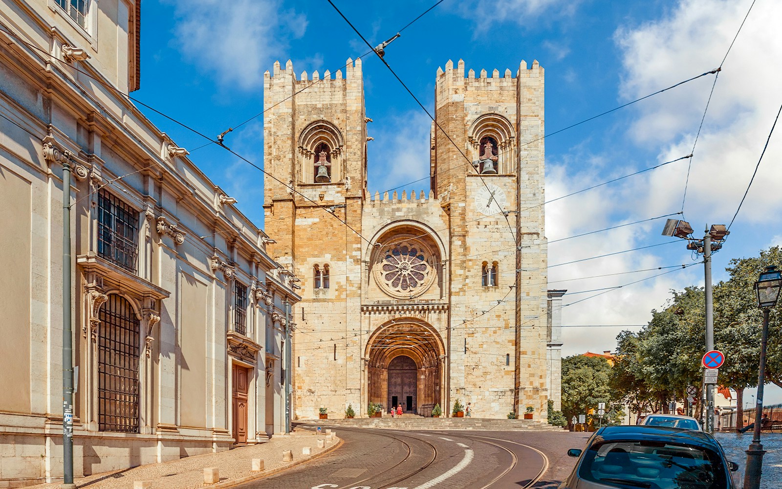 Lisbon Cathedral facade with twin towers and rose window, Portugal.