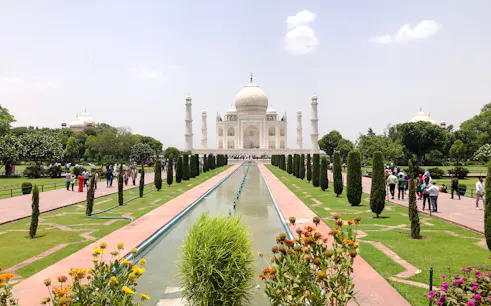 Taj Mahal view with gardens and reflecting pool, Agra tour.