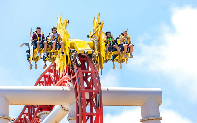 Roller coaster riders at Terra Mitica theme park in Spain.