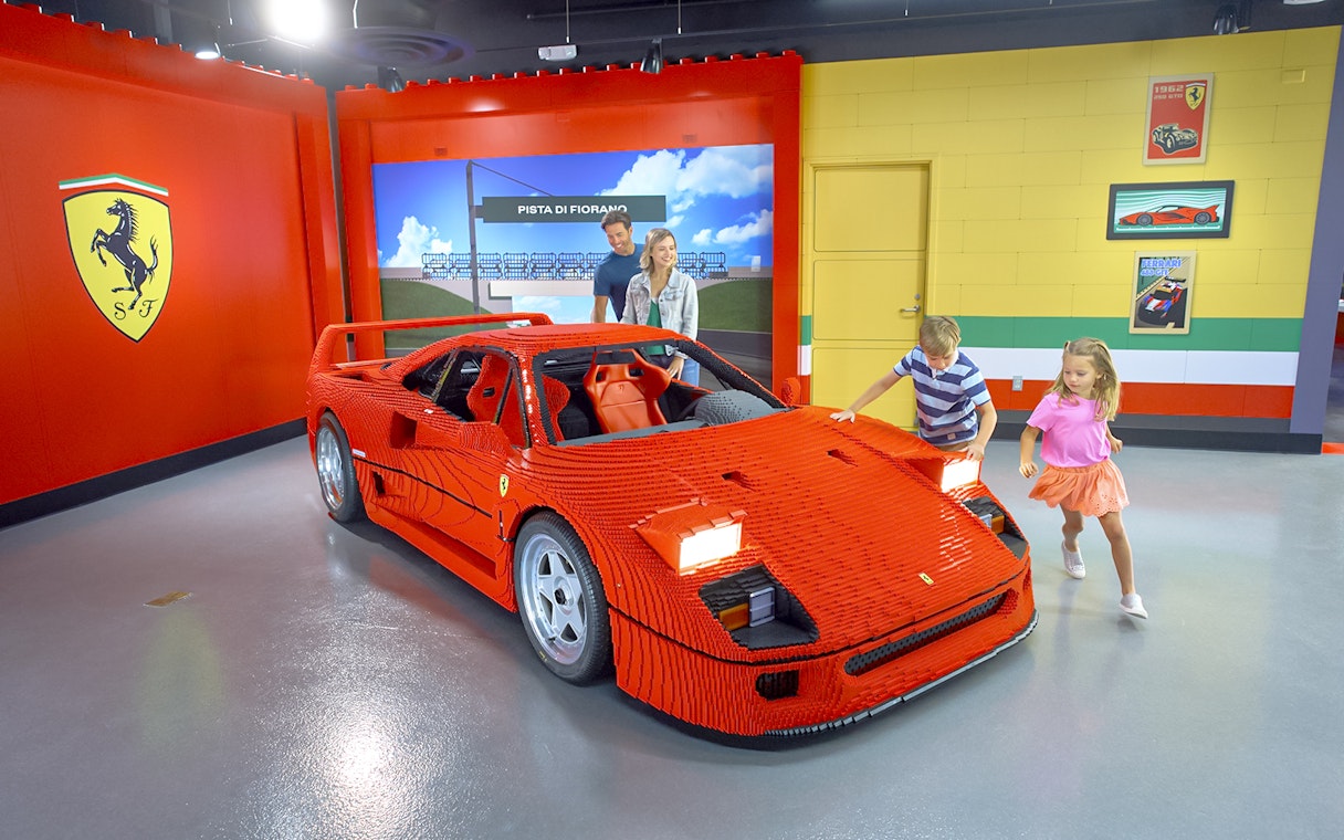 Children exploring a LEGO Ferrari at LEGOLAND® California's Build and Race attraction.