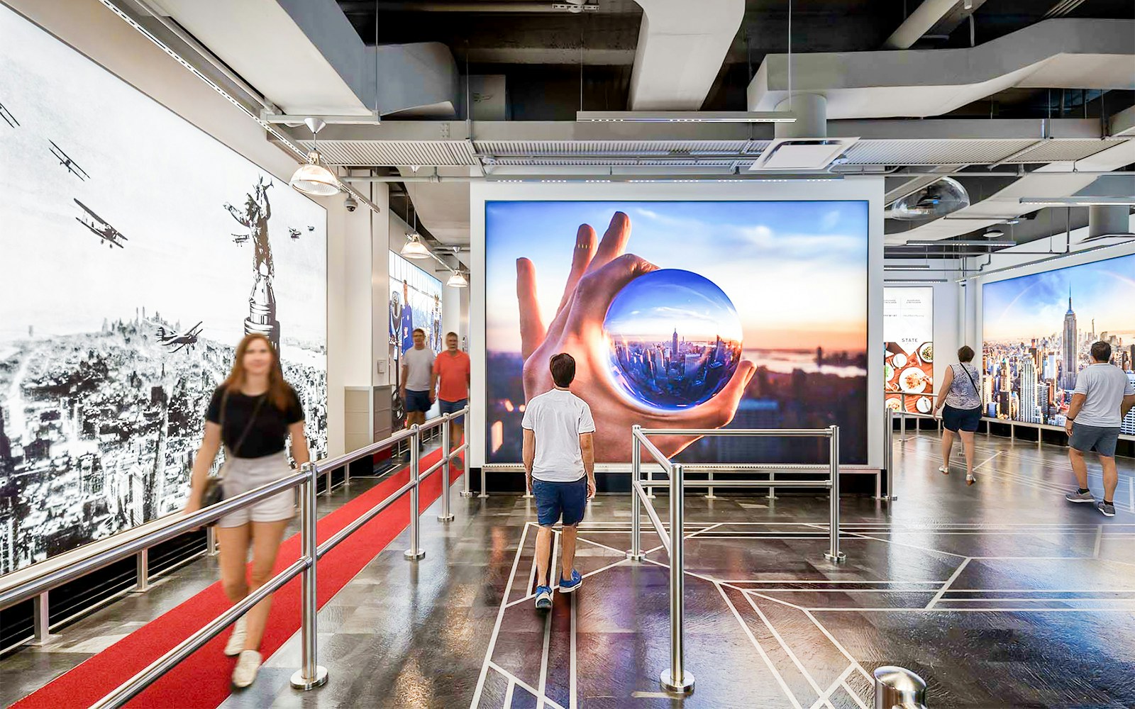 Visitors inside the Empire State Building exhibit in NYC.