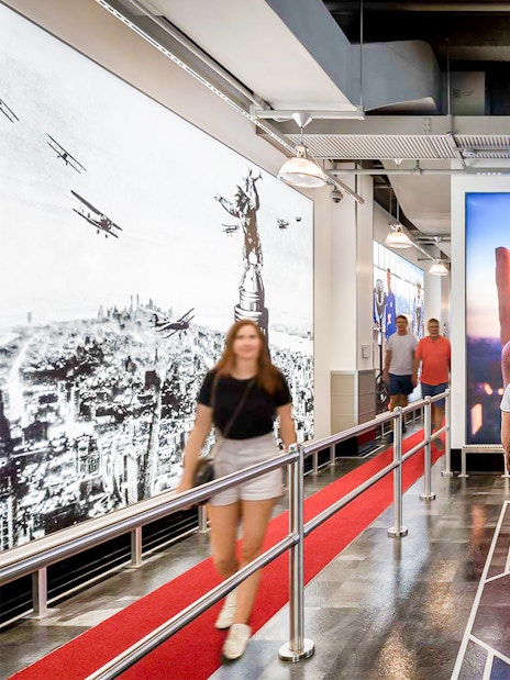 Visitors inside the Empire State Building exhibit in NYC.