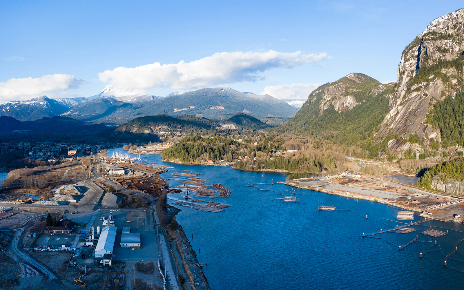 Aerial view of Howe Sound inlet with mountains and forested landscape, Canada.