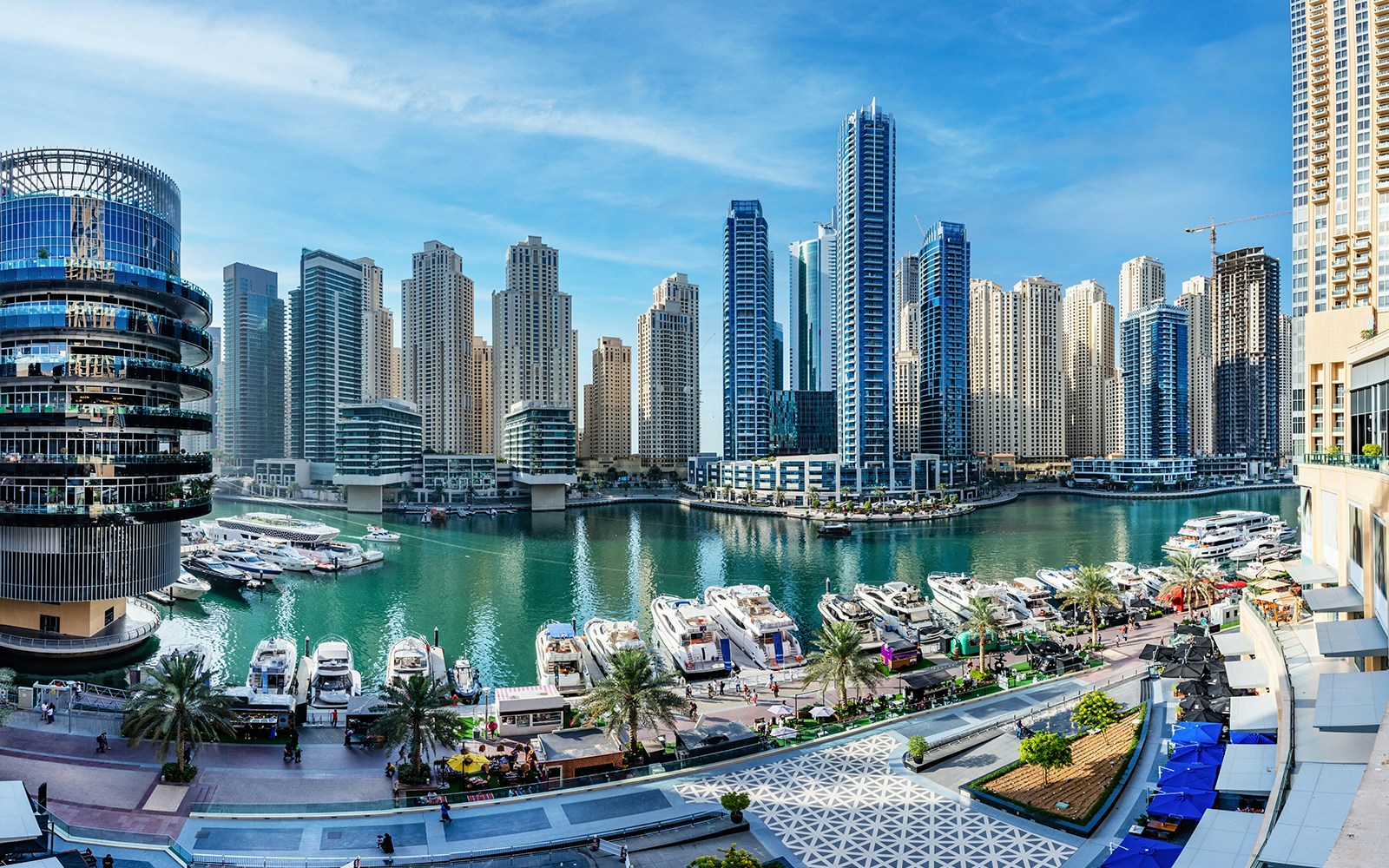 Dubai Marina Mall exterior with waterfront view and surrounding skyscrapers in Dubai, UAE.