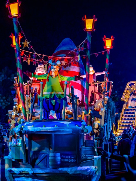 Parade float with Astérix character at night in Astérix Park, France.