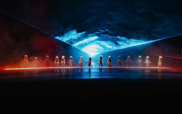 Performers in masks on stage with blue and red lighting at The Legacy of a Generation Show.