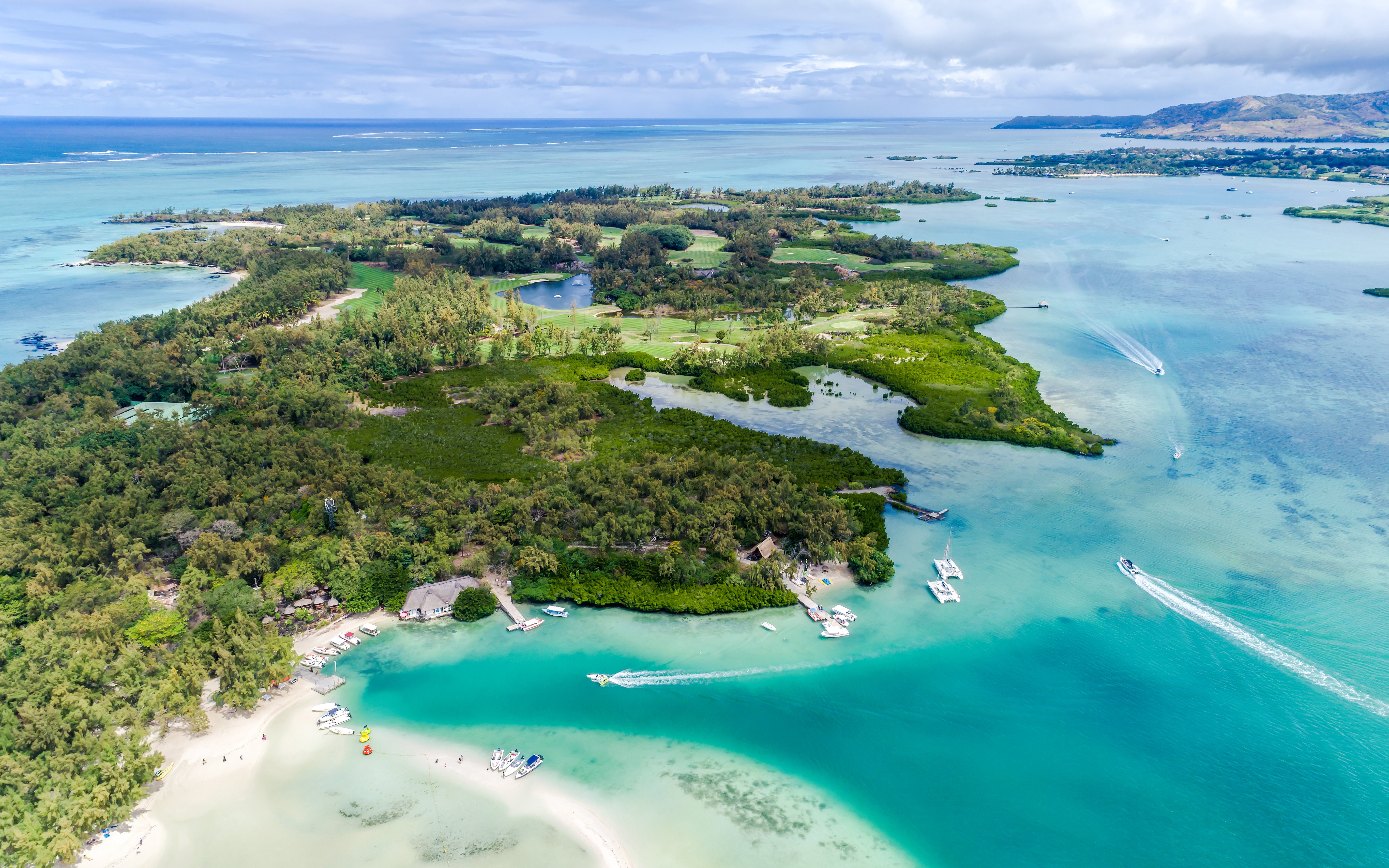 Aerial view of Ile Aux Cerfs, Mauritius, featuring lush greenery and turquoise waters.