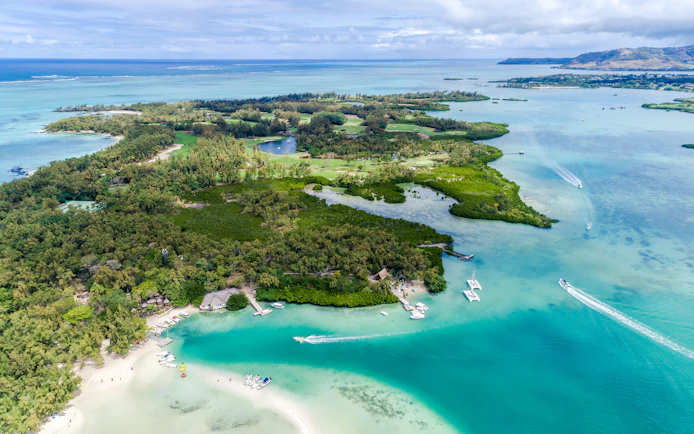 Aerial view of Ile Aux Cerfs, Mauritius, featuring lush greenery and turquoise waters.