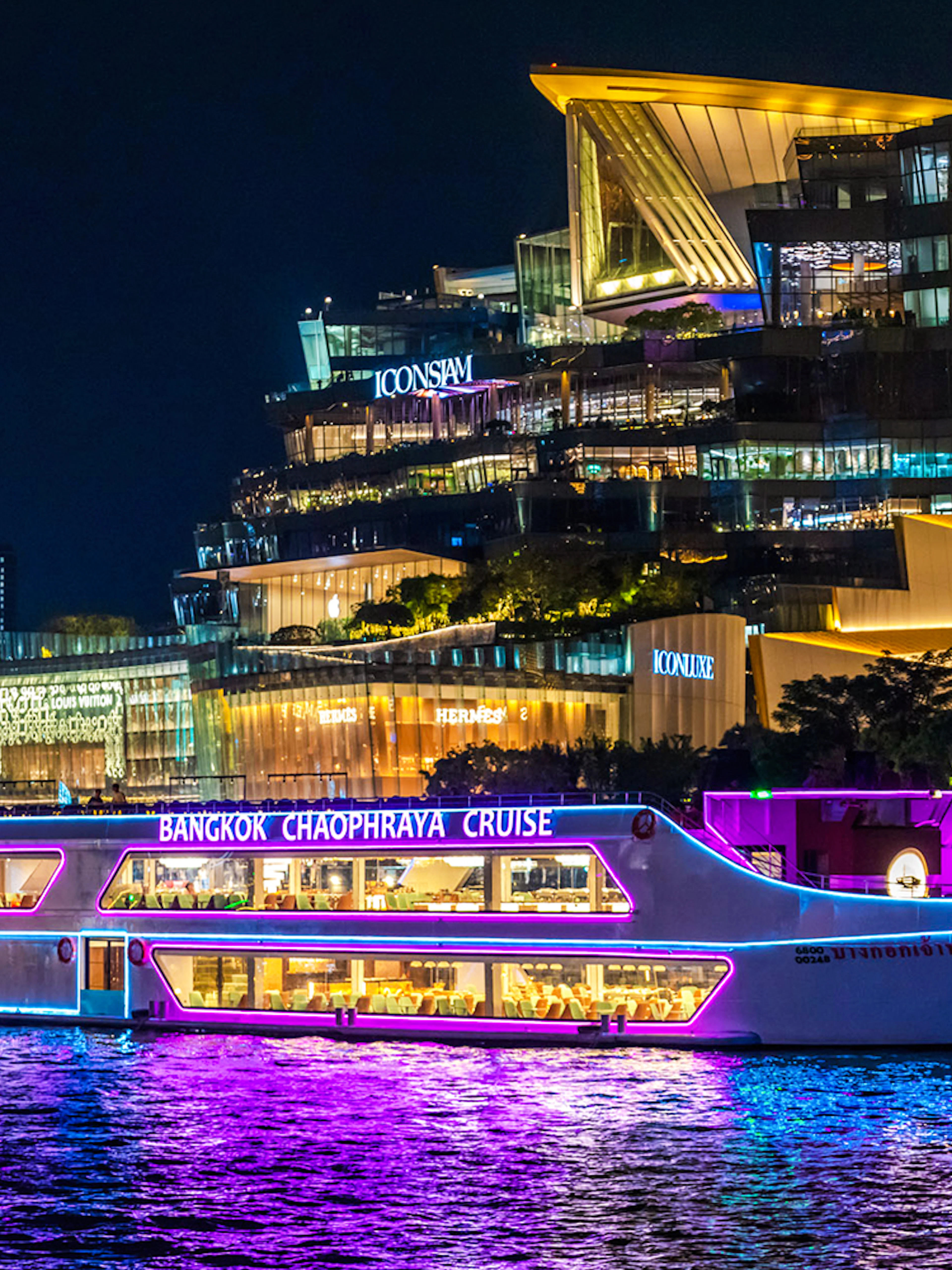 Bangkok Chaophraya dinner cruise passing Iconsiam at night.