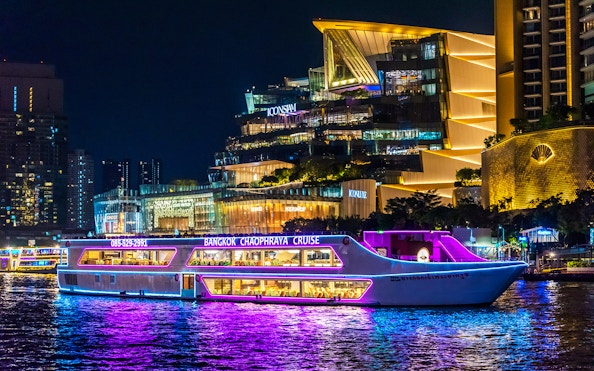Bangkok Chaophraya dinner cruise passing Iconsiam at night.