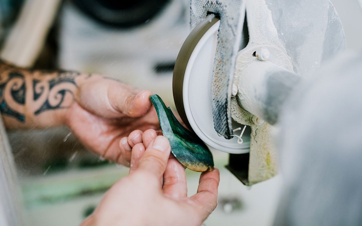Crafting jade on a grinding wheel during Mountain Jade Highlights Tour.