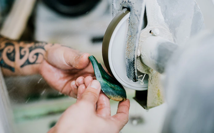 Crafting jade on a grinding wheel during Mountain Jade Highlights Tour.