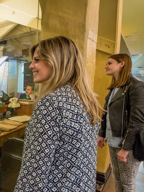 Guests observing the historic operations room inside the Churchill War Rooms, London.