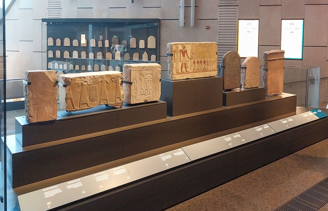 Ancient Egyptian artifacts displayed at the Grand Egyptian Museum.