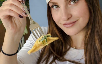 Person holding fork with pasta during Florence pasta class.